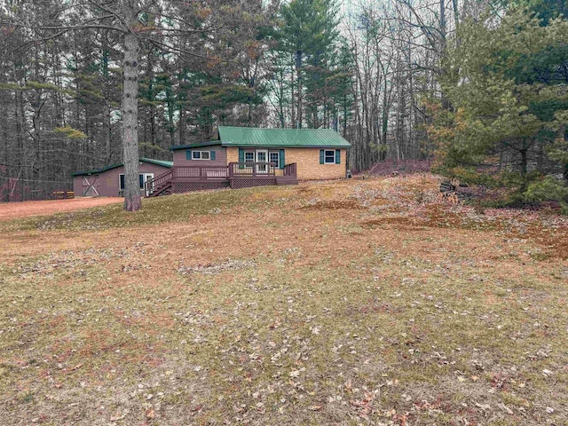 7589 Nose Lake Rd, Rhinelander, WI 54501 - view of front of home featuring metal roof and a deck