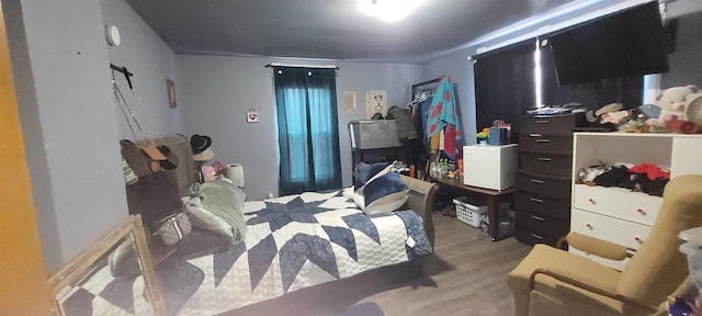 bedroom with wood finished floors