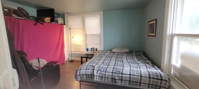 bedroom featuring wood finished floors