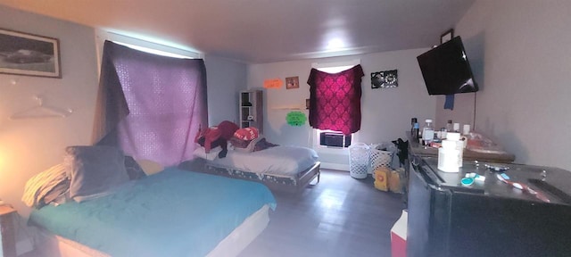 bedroom with wood finished floors