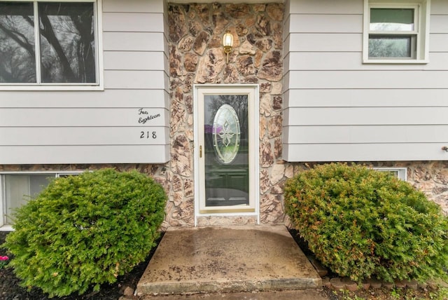 view of exterior entry with stone siding