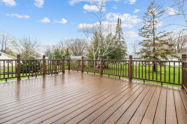 wooden terrace with a yard
