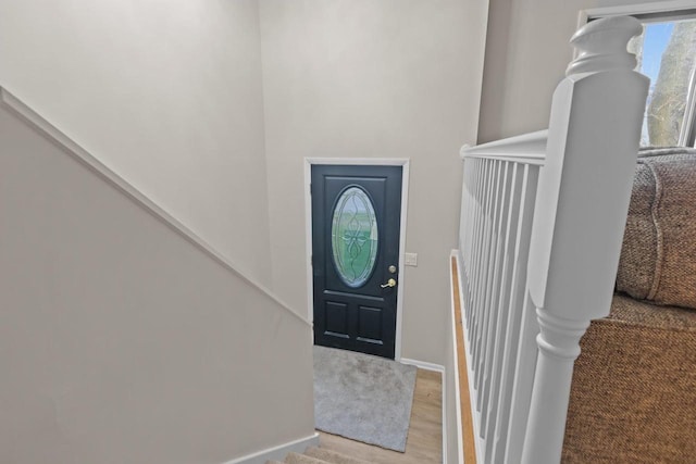 entrance foyer with stairs and light wood-type flooring