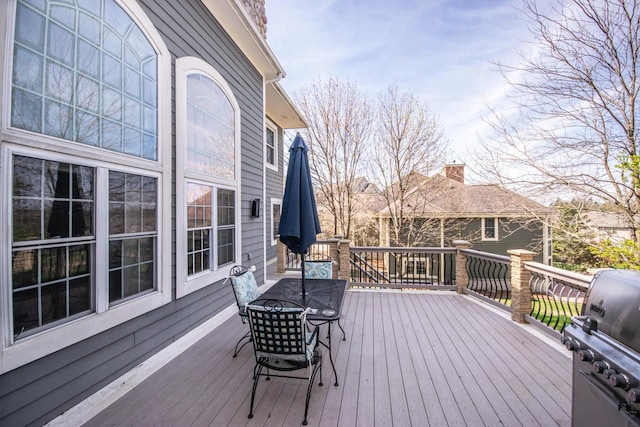 2704 Kettle Ct, West Bend, WI 53090 - deck featuring a grill and outdoor dining space