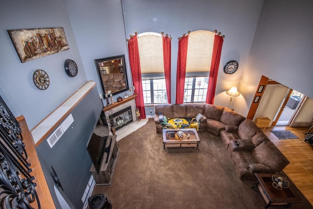 2704 Kettle Ct, West Bend, WI 53090 - living room featuring a fireplace and a towering ceiling