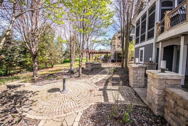 2704 Kettle Ct, West Bend, WI 53090 - view of yard featuring a patio and a pergola