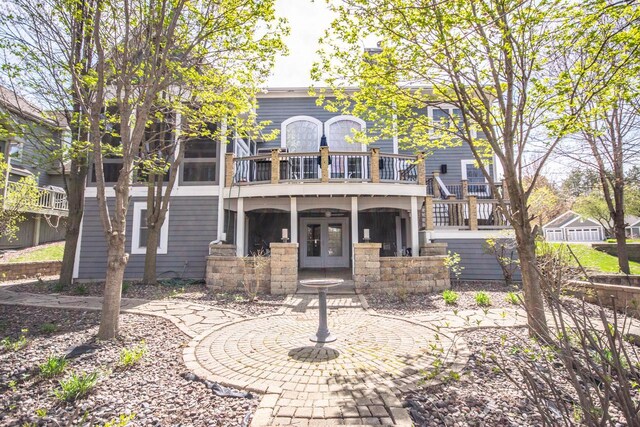 2704 Kettle Ct, West Bend, WI 53090 - back of house featuring french doors and a balcony