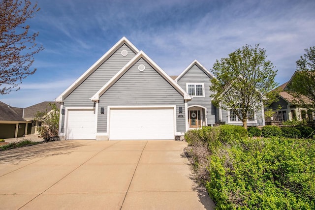 2704 Kettle Ct, West Bend, WI 53090 - traditional-style home with concrete driveway and a garage