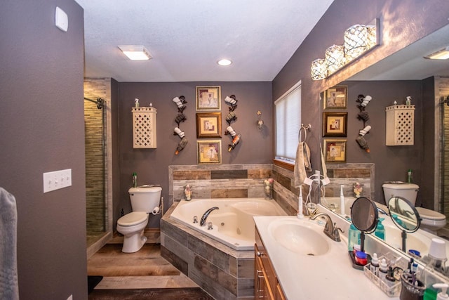 2704 Kettle Ct, West Bend, WI 53090 - full bath with toilet, wood finished floors, a tub with jets, vanity, and a shower stall