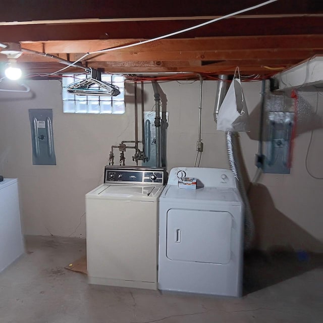 laundry area with washer and clothes dryer, laundry area, and electric panel