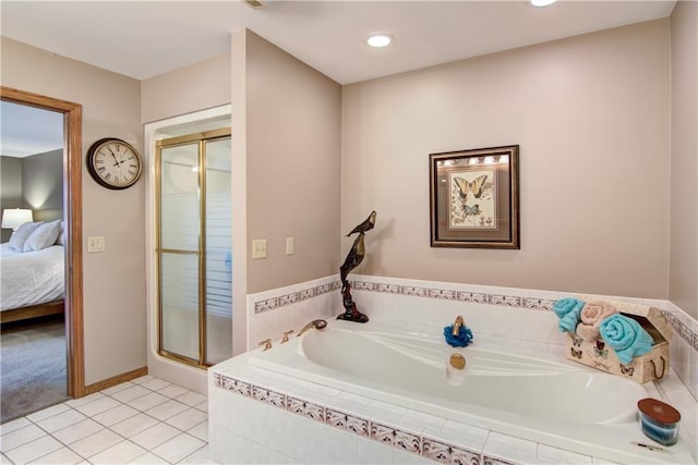 bathroom featuring recessed lighting, ensuite bathroom, a bath, a shower stall, and tile patterned floors