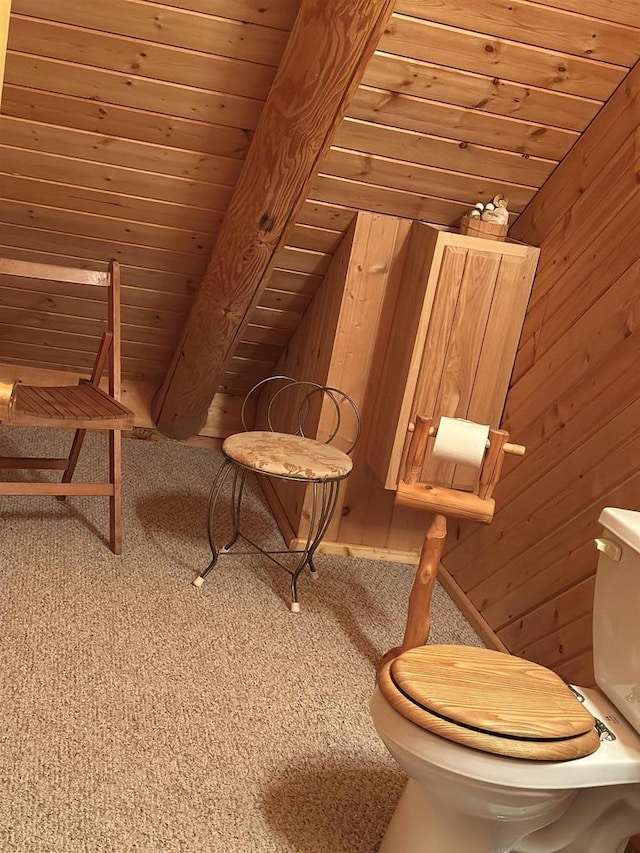 unfurnished room featuring wooden ceiling, wood walls, lofted ceiling, and carpet floors