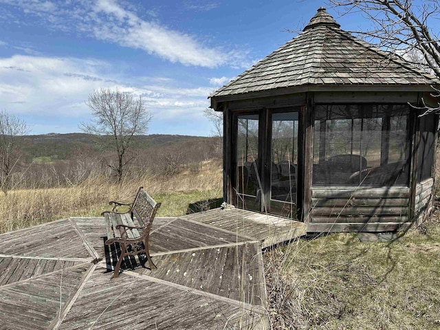 wooden deck featuring a gazebo