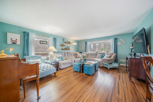 living room featuring a wealth of natural light and wood finished floors