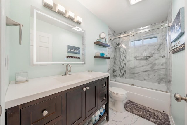 full bathroom featuring vanity, toilet, bath / shower combo with glass door, and marble finish floor