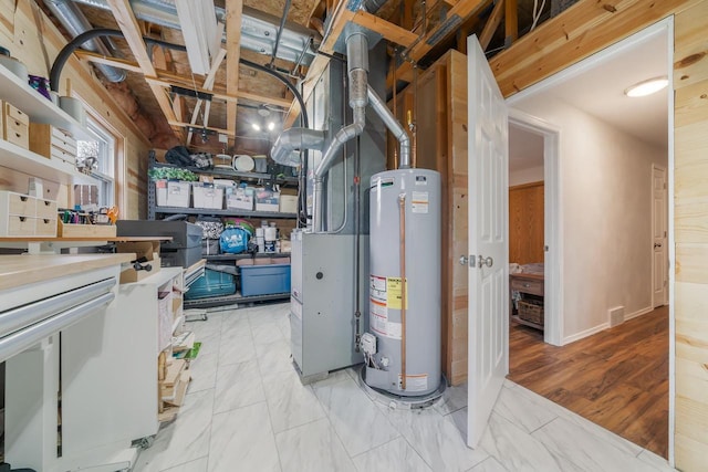 utilities with visible vents and gas water heater