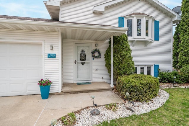 view of exterior entry with a garage