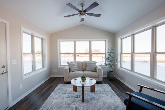 living room with vaulted ceiling, ceiling fan, baseboards, and dark wood finished floors