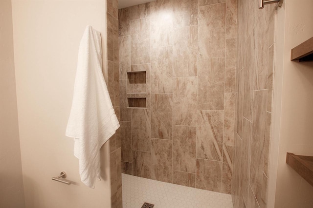 full bathroom with a tile shower