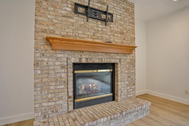 4109 Oak Ter, Weston, WI 54476 - details featuring a fireplace, baseboards, and wood finished floors