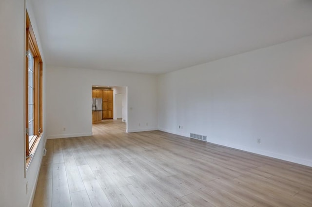 4109 Oak Ter, Weston, WI 54476 - spare room with baseboards, light wood-style flooring, and visible vents