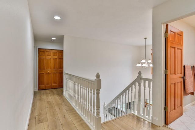 4109 Oak Ter, Weston, WI 54476 - hallway with an upstairs landing, hardwood / wood-style floors, baseboards, a chandelier, and recessed lighting