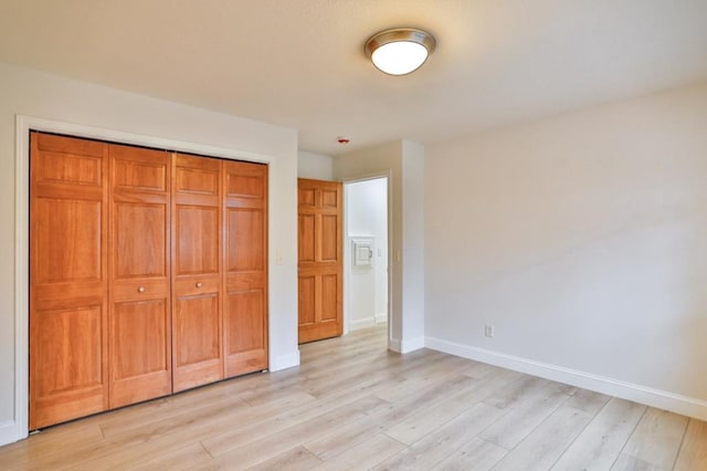 4109 Oak Ter, Weston, WI 54476 - unfurnished bedroom with light wood-style flooring, baseboards, and a closet