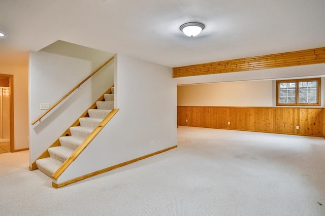 4109 Oak Ter, Weston, WI 54476 - below grade area with wood walls, stairs, carpet floors, and baseboards