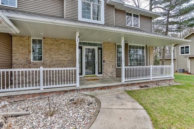 4109 Oak Ter, Weston, WI 54476 - entrance to property with a yard, a porch, brick siding, and central AC unit