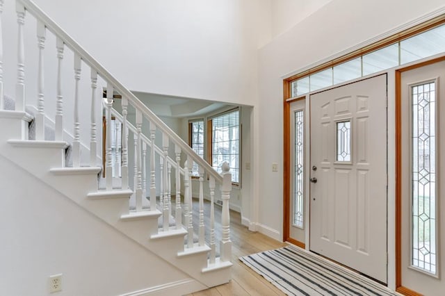4109 Oak Ter, Weston, WI 54476 - foyer featuring a towering ceiling, wood finished floors, baseboards, and stairs