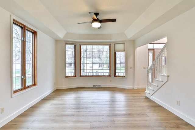 4109 Oak Ter, Weston, WI 54476 - unfurnished room with a ceiling fan, a wealth of natural light, baseboards, and light wood finished floors