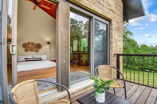 exterior space featuring ceiling fan, lofted ceiling, and wood-type flooring