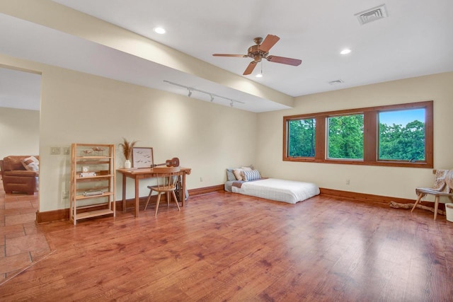 bedroom featuring recessed lighting, baseboards, visible vents, and wood finished floors