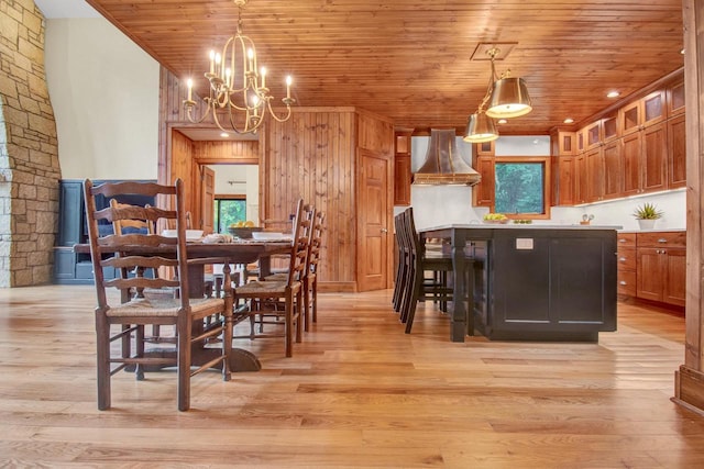 dining space featuring a notable chandelier, wooden ceiling, and light wood-style floors