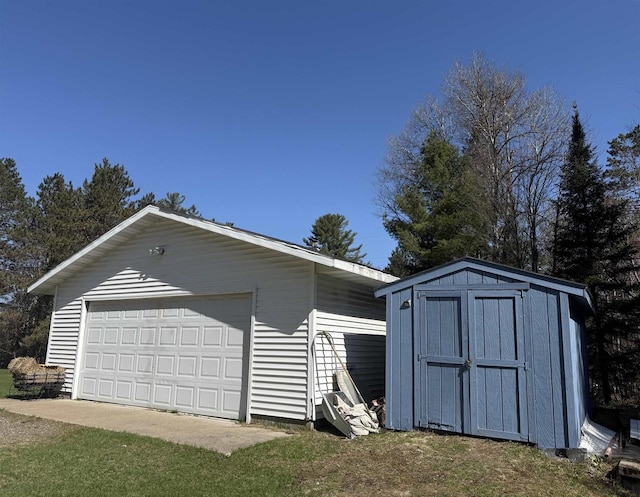 detached garage with a storage shed