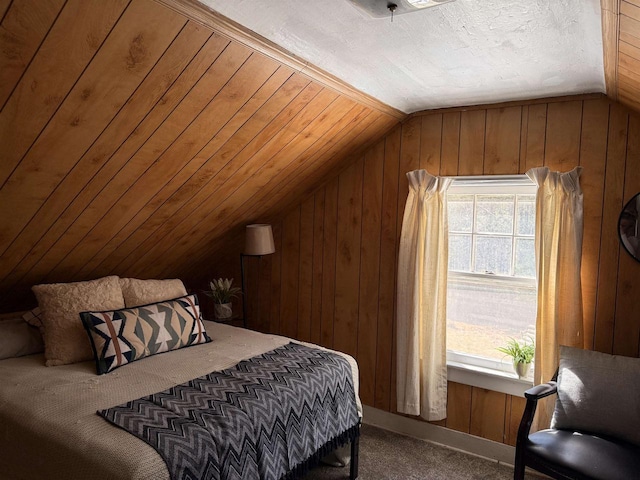 bedroom with lofted ceiling, carpet floors, and wood walls