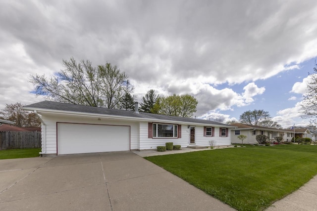ranch-style home featuring a front yard, driveway, fence, and a garage