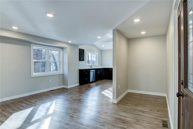 bar with wood finished floors, visible vents, baseboards, dishwasher, and recessed lighting