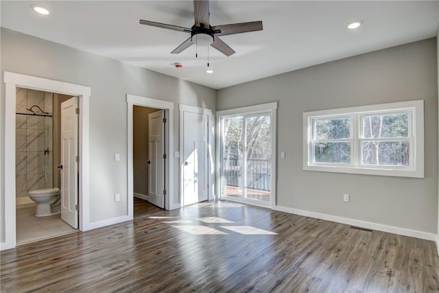 unfurnished bedroom featuring wood finished floors, access to exterior, visible vents, baseboards, and recessed lighting