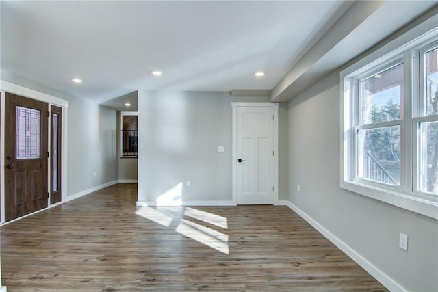 foyer with recessed lighting, baseboards, and wood finished floors