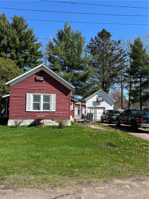 view of home's exterior with a yard