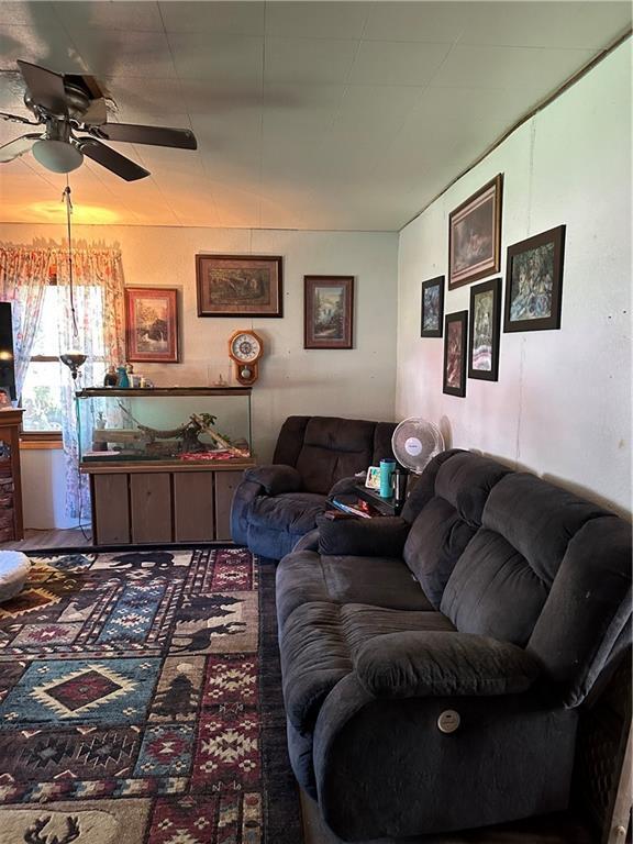 living room with a ceiling fan
