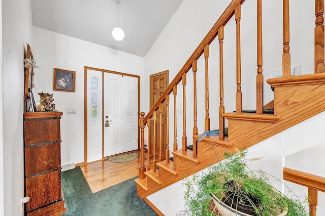 3280 County Rd S, Little Suamico, WI 54141 - entrance foyer featuring lofted ceiling, stairway, and carpet flooring