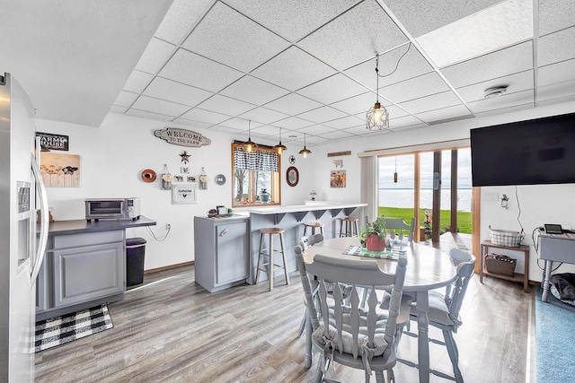 3280 County Rd S, Little Suamico, WI 54141 - dining room featuring light wood-style flooring, a wealth of natural light, and a toaster
