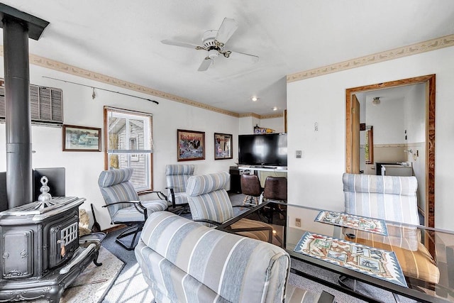 3280 County Rd S, Little Suamico, WI 54141 - living room with a ceiling fan, a wood stove, and a wall unit AC