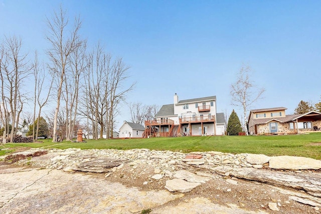 3280 County Rd S, Little Suamico, WI 54141 - back of property featuring a yard, a wooden deck, and a chimney