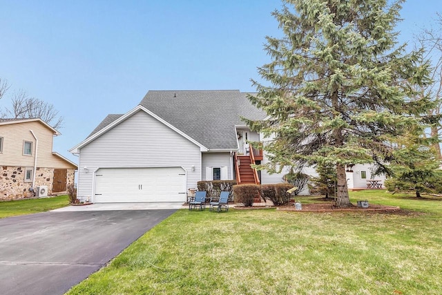 3280 County Rd S, Little Suamico, WI 54141 - view of front of house with a shingled roof, aphalt driveway, a front lawn, and an attached garage