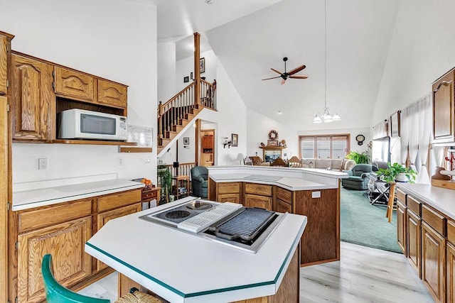 3280 County Rd S, Little Suamico, WI 54141 - kitchen featuring a center island, white appliances, open floor plan, and high vaulted ceiling