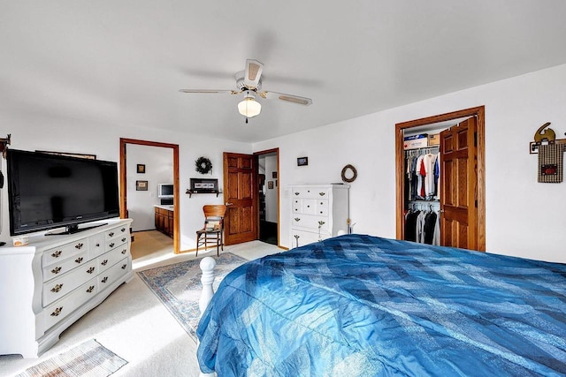 3280 County Rd S, Little Suamico, WI 54141 - bedroom featuring a ceiling fan, a closet, a walk in closet, ensuite bathroom, and light carpet