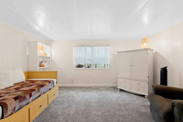 carpeted bedroom with baseboards